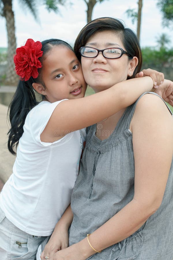 Asian girl hug on mother