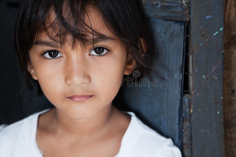 Portrait of an Asian girl against wall in natural light - Manila, Philippines. Portrait of an Asian girl against wall in natural light - Manila, Philippines