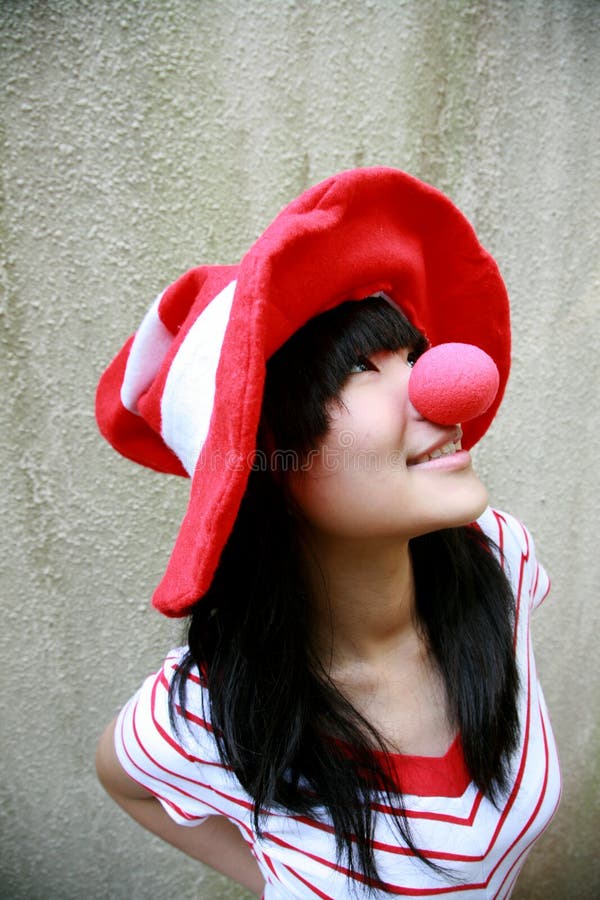 Asian girl with red nose and hat