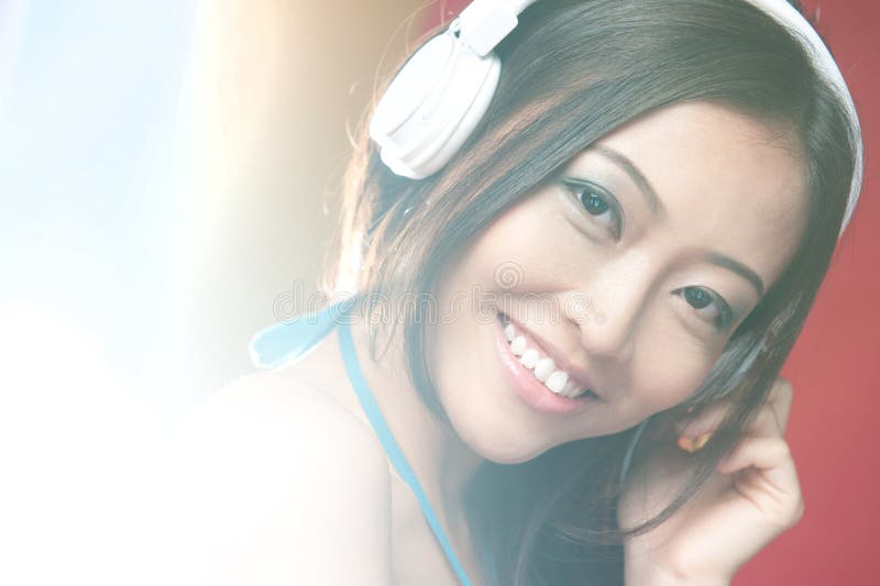 Asian girl smiling with headphones