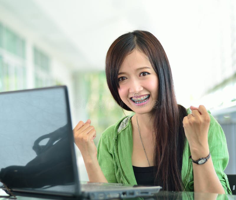 Asian girl smiling in success job