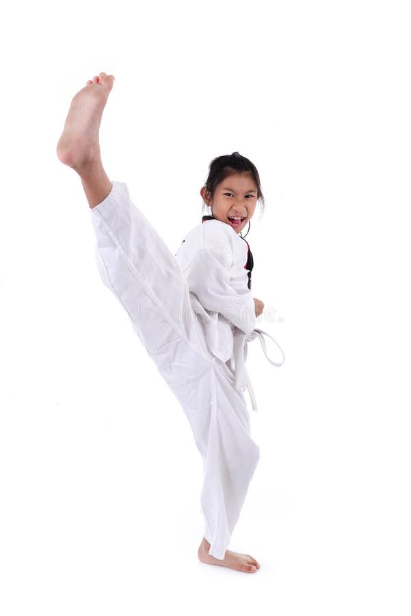 Asian girl stretching leg in martial arts practice training kick.