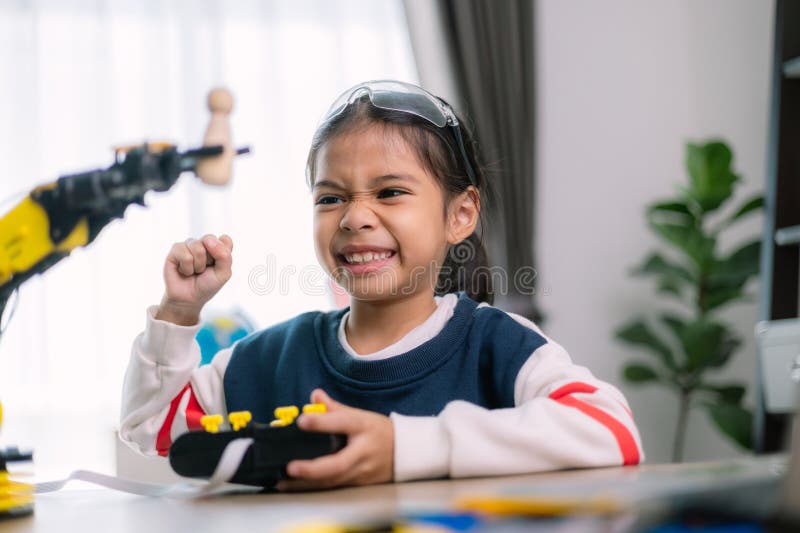 Asian girls were learning robot programming and getting lessons control on robot arms. Laboratory. Mathematics, engineering royalty free stock image