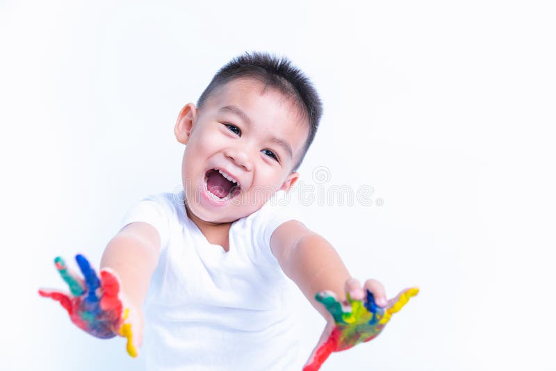 Asian happy little baby boy show hand he have water color or finger paint on hands royalty free stock photo Asian happy little baby boy show hand he have water color or finger paint on hands royalty free stock photo