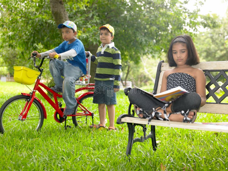 Asian kids playing in the park stock photo Asian kids playing in the park stock photo