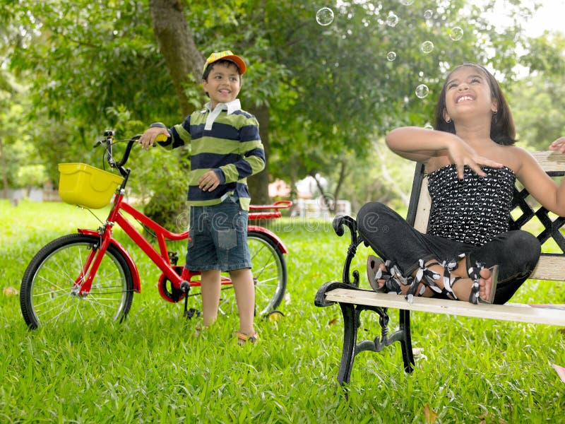 Asian kids playing in the park