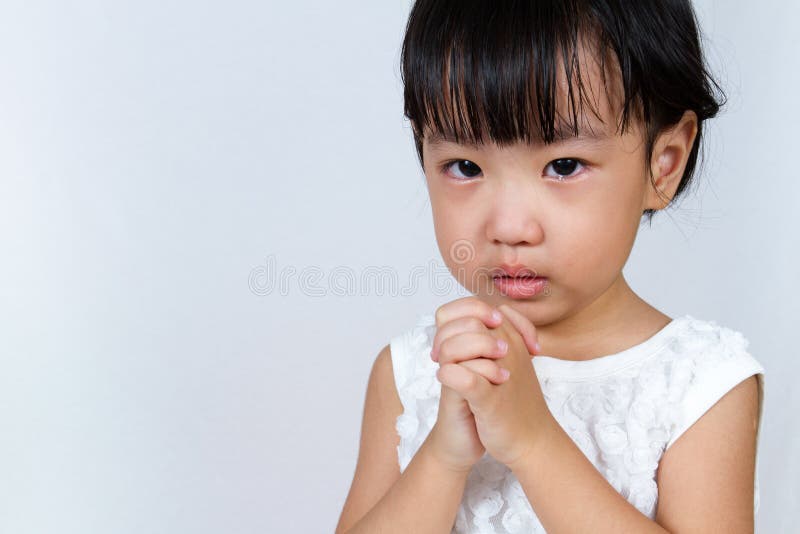 Asian Little Chinese Girl Praying in White Background