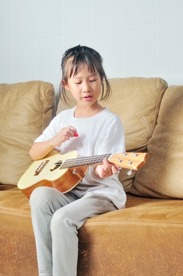 Asian Little Girl Playing Ukulele Stock Photo Image of childhood