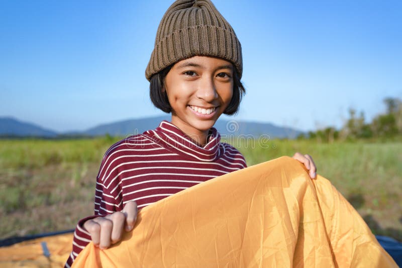 Asian little girl smile and happy enjoying Nature at camping in the winter. The concept of family lifestyle on holiday stock photography Asian little girl smile and happy enjoying Nature at camping in the winter. The concept of family lifestyle on holiday stock photography