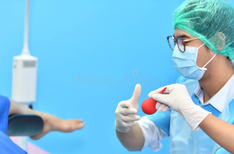 Asian male obstetrician and nurse are delivered to the patient stock photo Asian male obstetrician and nurse are delivered to the patient stock photo