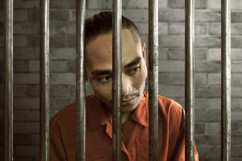 Asian man in prison royalty free stock photo Asian man in prison royalty free stock photo