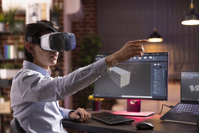 Asian man using vr headset and working remotely on 3d container model royalty free stock photography