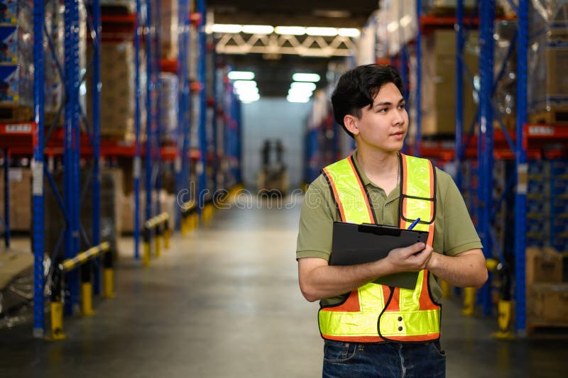 Asian man warehouse managers checking stock in workplace warehouse. industry logistic export import distribution concept stock photo