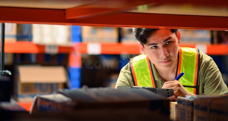 Asian man warehouse managers checking stock in workplace warehouse. industry logistic export import distribution concept stock photos