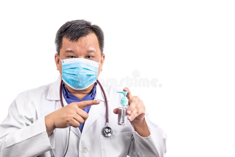 Asian medical doctor recommends facemask and hand sanitizer for protection against virus germs royalty free stock photography Asian medical doctor recommends facemask and hand sanitizer for protection against virus germs royalty free stock photography
