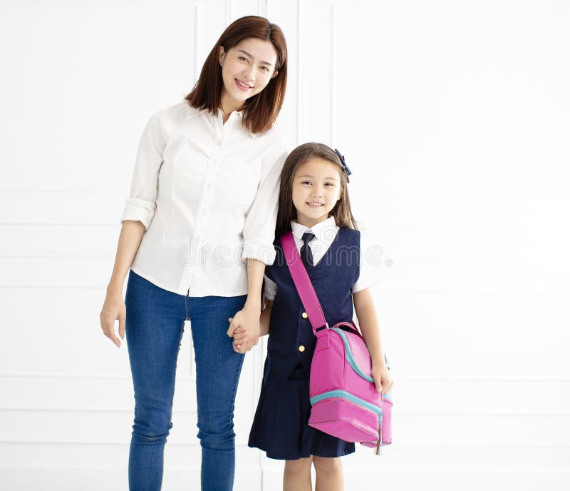 Mother holding hand of daughter ready go to school stock image Mother holding hand of daughter ready go to school stock image