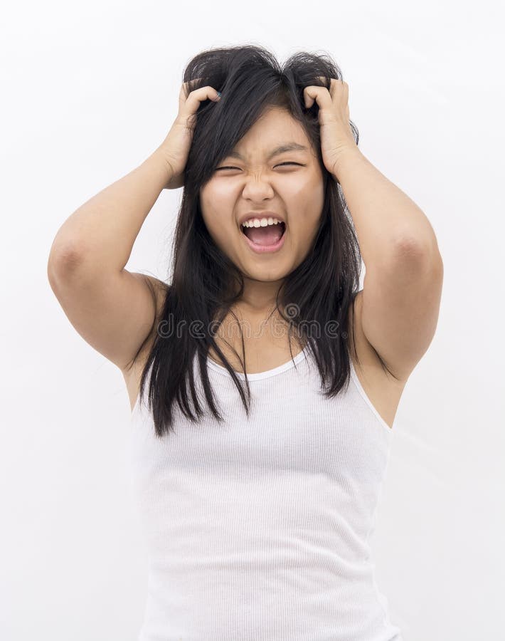 Asian neurotic girl pulling her hair. Asian neurotic girl pulling her hair
