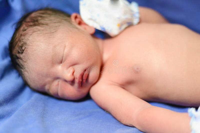 Asian newborn Infant Baby boy on blue blanket with umbilical royalty free stock images Asian newborn Infant Baby boy on blue blanket with umbilical royalty free stock images