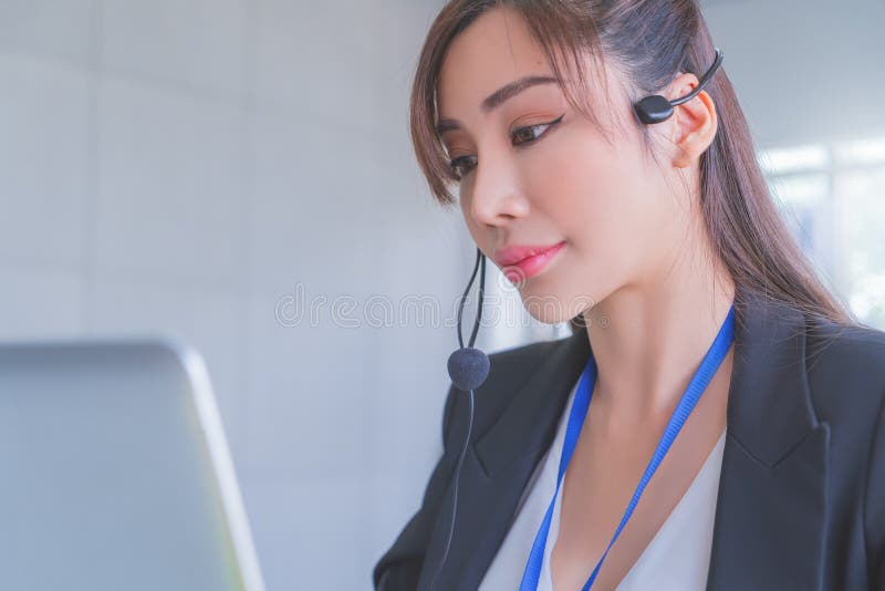 Asian Operator, Customer service assistance is answering call from client over internet computer call