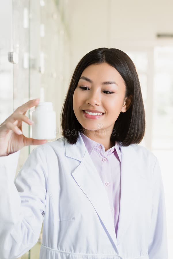 Asian Pharmacist in White Coat Looking Stock Photo - Image of asian ...