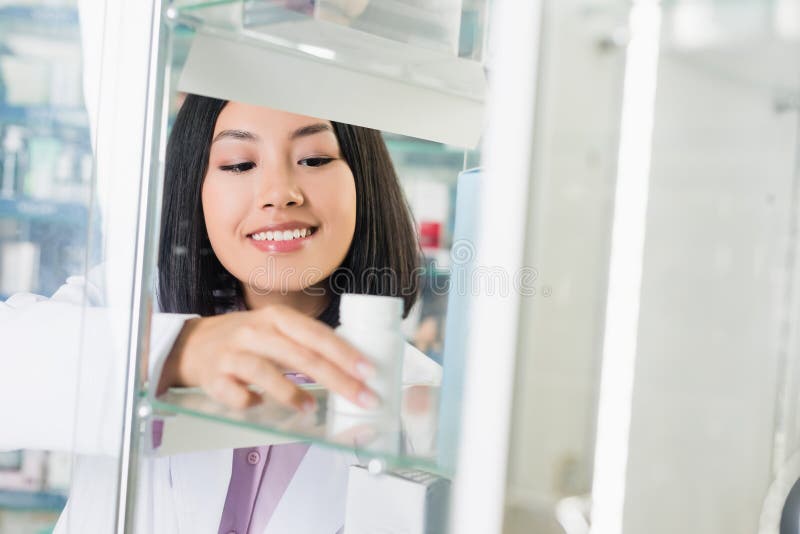 Asian Pharmacist in White Coat Taking Stock Photo - Image of glass ...