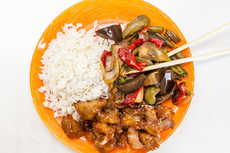 Asian rice with chicken and vegetables in sweet and sour sauce teriyaki