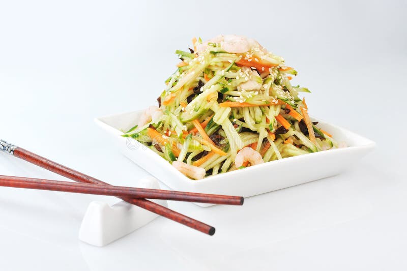 Asian salad served on plate isolated on white