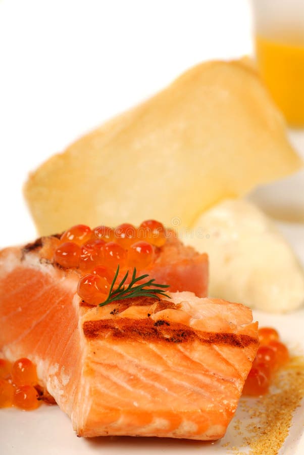 Asian salmon served with caviar and pumpkin soup