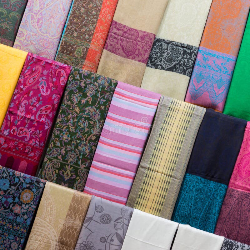 Asian scarves with a bright colorful pattern at the oriental bazaar. royalty free stock photos