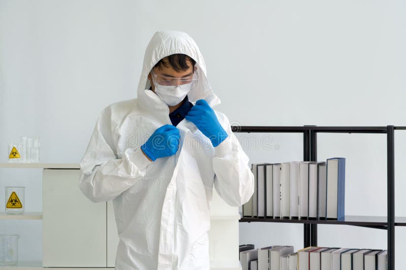 Asian Scientist with Face Mask Wearing Virus Protective Clothing before ...