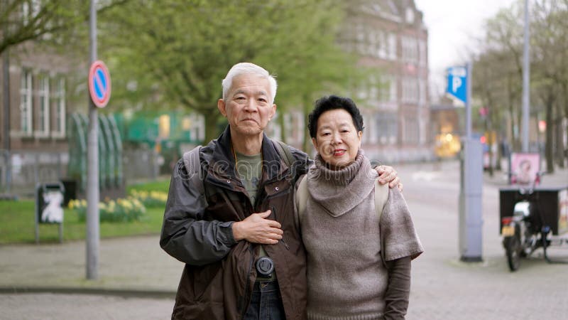 Asian senior couple traveling to Europe together having fun experience together stock image Asian senior couple traveling to Europe together having fun experience together stock image