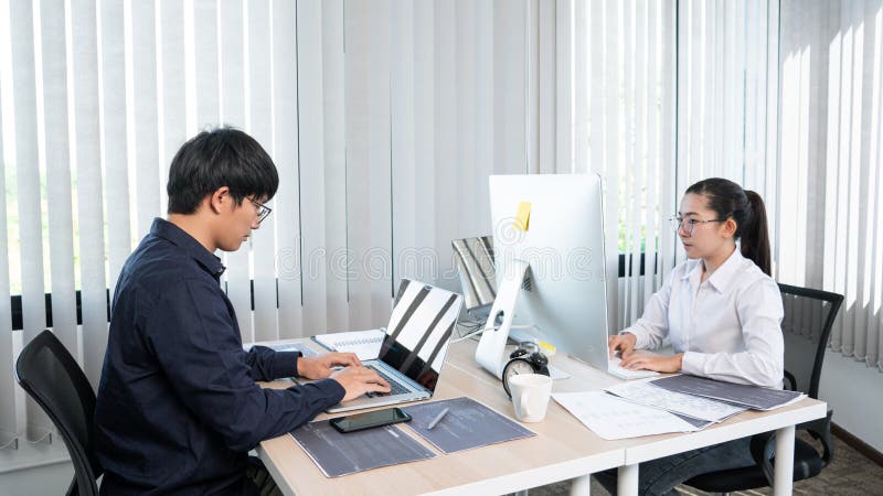 Asian Software Engineer Programmer Team Working Together on Project of