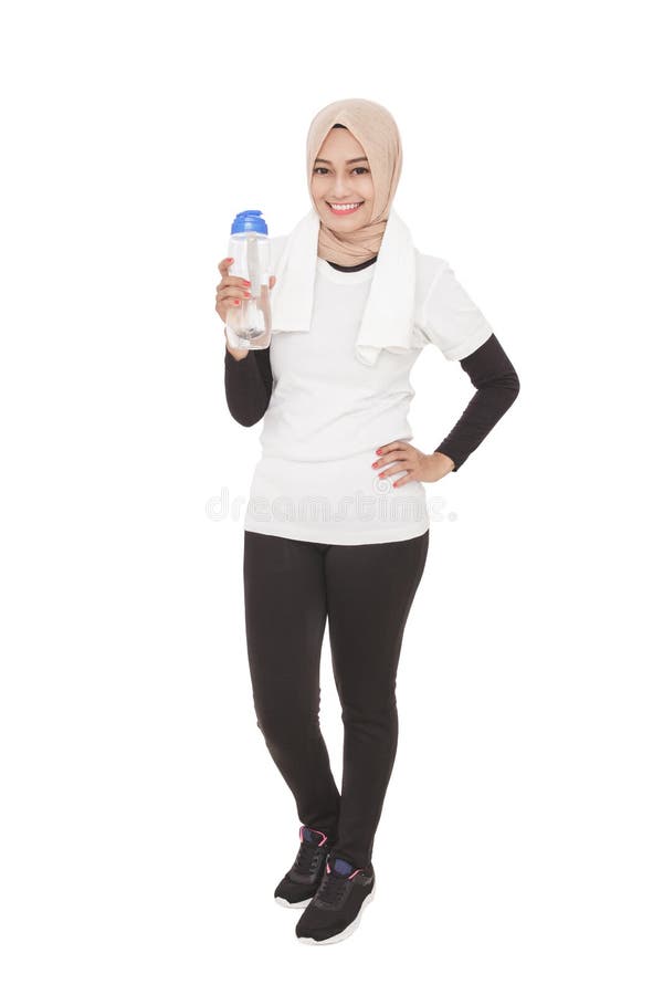 Asian sporty woman wearing hijab holding a bottle of mineral wat royalty free stock image Asian sporty woman wearing hijab holding a bottle of mineral wat royalty free stock image