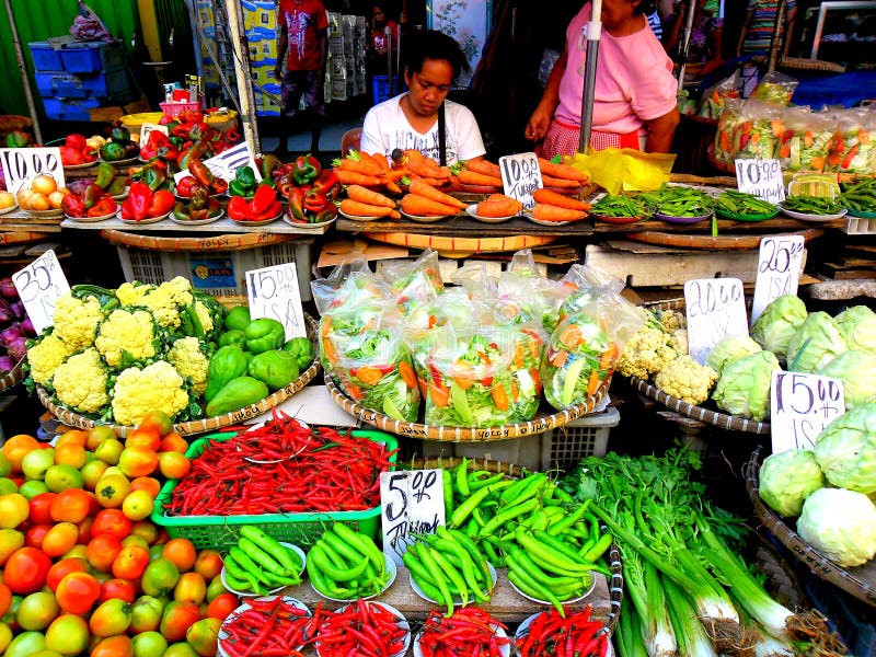 Asian street vendor selling fruits and vegetable in quiapo, manila, philippines in asia royalty free stock photography Asian street vendor selling fruits and vegetable in quiapo, manila, philippines in asia royalty free stock photography