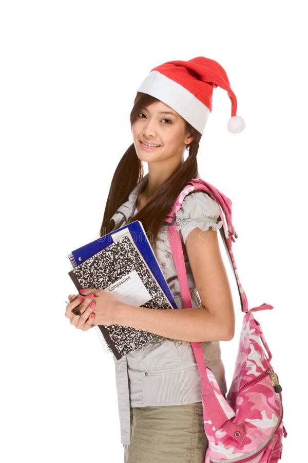 Asian student girl in Christmas Santa hat and bag royalty free stock photos Asian student girl in Christmas Santa hat and bag royalty free stock photos
