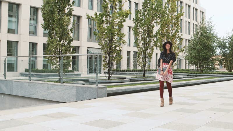 Asian student girl walking in city