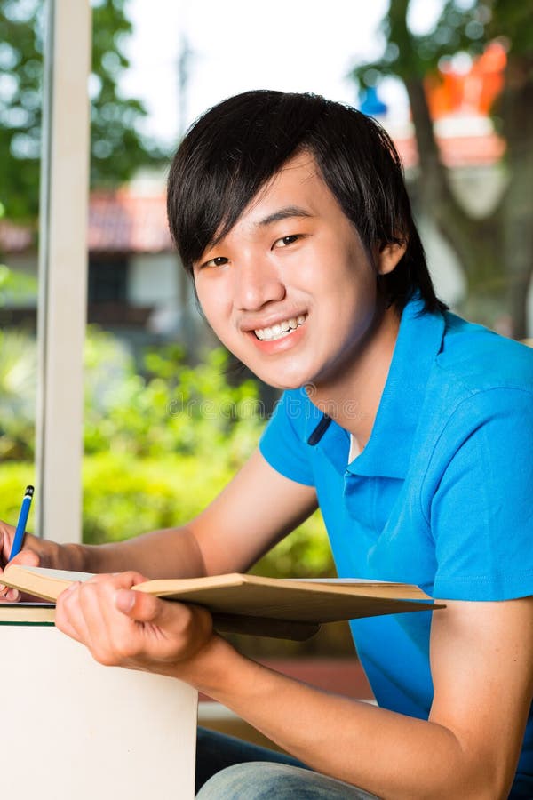 Asian student reading book or textbook learning royalty free stock images Asian student reading book or textbook learning royalty free stock images