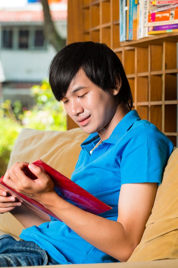 Asian student reading book or textbook learning stock images Asian student reading book or textbook learning stock images