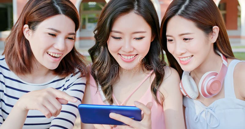 Asian students use smartphone royalty free stock photos