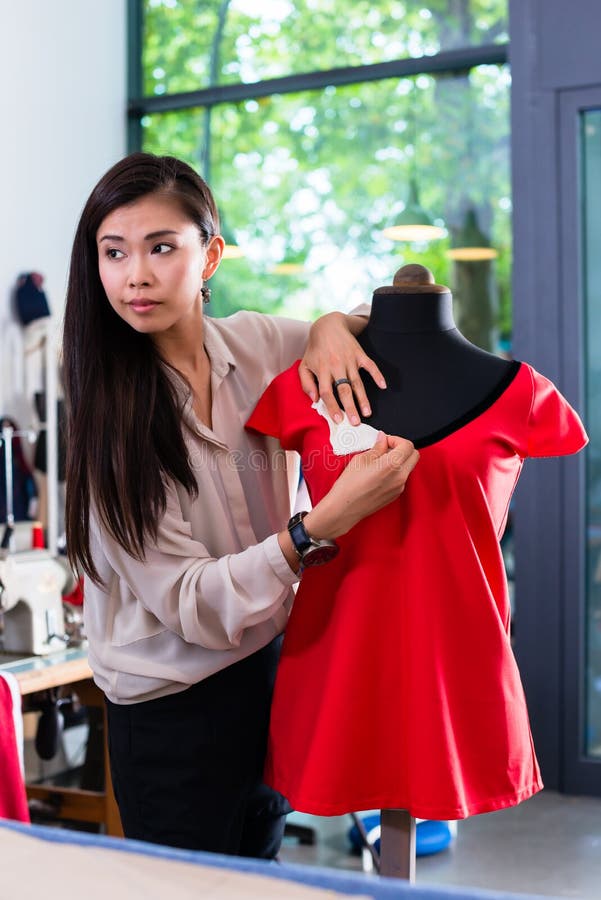 Asian Tailor Adjusts Garment Design on Mannequin Stock Photo - Image of ...