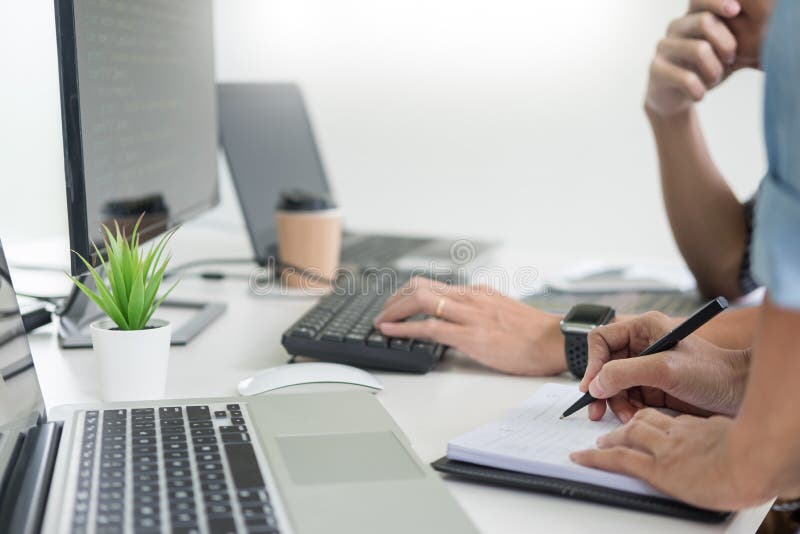 Asian team Outsource Developer Looking Screen Programming Code Working with Laptop Computer Software stock image Asian team Outsource Developer Looking Screen Programming Code Working with Laptop Computer Software stock image