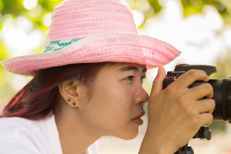 Asian Teen is an Amateur Photographer Practicing Photography