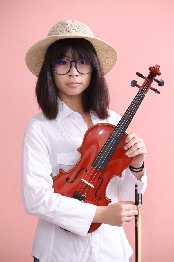 Asian Teen with Violin Glasses Hat Smile Stock Image pic