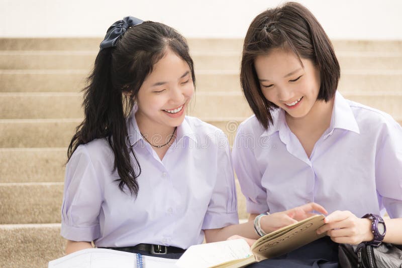 Asian Thai high schoolgirls student couple in school studying stock photos Asian Thai high schoolgirls student couple in school studying stock photos
