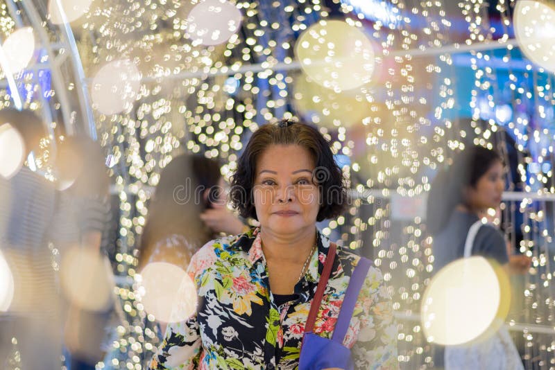 Asian woman with bokeh of light for happy new year stock photo