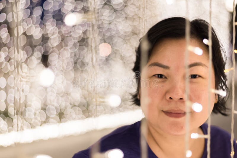 Asian woman with bokeh of light for happy new year royalty free stock photos