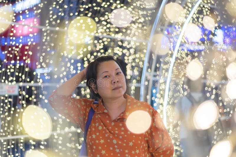 Asian woman with bokeh of light for happy new year royalty free stock images