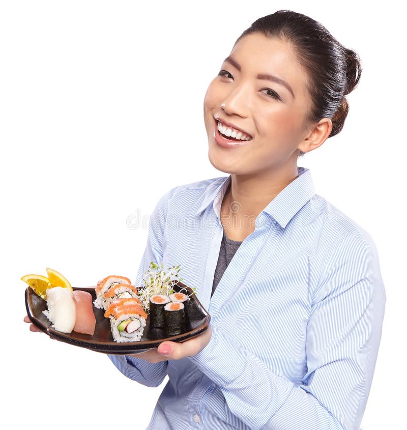 Asian woman eating sushi. Shallow depth of field, focu