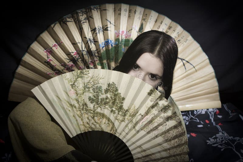 Asian woman with fan