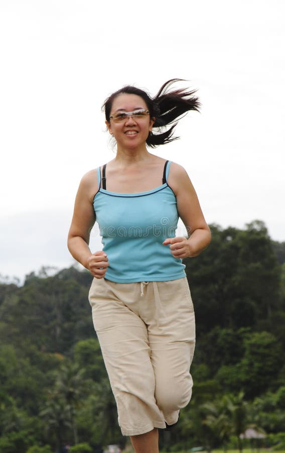 Asian woman jogging